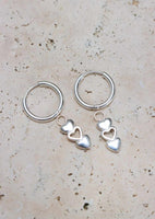 Cool earring with handy click system and heart pendant.Single Hoop Open Hearts Silver